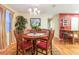 Dining area with wood table, seating for six, and light fixture at 1226 E Schwartz E Blvd, Lady Lake, FL 32159