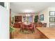 Cozy dining room featuring a wooden table with seating for four, a hutch, and hardwood floors at 1226 E Schwartz E Blvd, Lady Lake, FL 32159