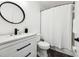 Modern bathroom featuring dark fixtures and white vanity set at 128 Calabria Springs Cv, Sanford, FL 32771