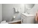 Half bathroom features a vanity with a sink, and mirror at 128 Calabria Springs Cv, Sanford, FL 32771