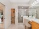 Bright bathroom with a separate shower and toilet area at 13336 Lake Turnberry Cir, Orlando, FL 32828