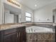 Ensuite bathroom features soaking tub and walk-in shower at 1385 Evergreen Park Cir, Lakeland, FL 33813