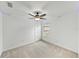 Bright bedroom featuring plush carpet, a ceiling fan, and neutral walls at 1385 Evergreen Park Cir, Lakeland, FL 33813