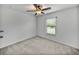 Cozy bedroom with carpet, ceiling fan and natural light from window at 1385 Evergreen Park Cir, Lakeland, FL 33813