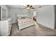 Neutral bedroom with carpet, white furniture, and an ensuite bathroom at 1385 Evergreen Park Cir, Lakeland, FL 33813