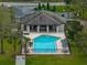 Aerial of Community pool with lounge chairs and surrounding landscaping at 1385 Evergreen Park Cir, Lakeland, FL 33813