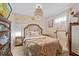 Cozy bedroom with decorative wall art, pendant lighting, neutral colors, and bright natural light at 142 Habersham Dr, Longwood, FL 32779