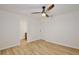 Bright bedroom featuring neutral walls, wood floors, trim and a modern ceiling fan at 14226 Nell Dr, Orlando, FL 32832