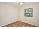 Bedroom showcasing natural light through the window and wood flooring at 14226 Nell Dr, Orlando, FL 32832