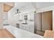 White kitchen with new stainless steel appliances, white cabinets, and wood-look floors at 14226 Nell Dr, Orlando, FL 32832