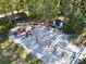 Community playground featuring colorful slides, swings, and a climbing dome in a sandy area at 14226 Nell Dr, Orlando, FL 32832