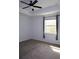 Cozy bedroom with neutral carpet, a ceiling fan, and a sunlit window at 14434 Swanley St, Orlando, FL 32832