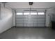 Clean, empty garage with sealed concrete floors and ample space for vehicles at 14434 Swanley St, Orlando, FL 32832