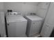 Laundry room equipped with Whirlpool washer and dryer units for convenience at 14434 Swanley St, Orlando, FL 32832