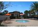 Community splash pad with palm trees, seating, and covered pavilion at 14434 Swanley St, Orlando, FL 32832