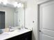 Bathroom features a large mirror, double sink vanity, and a door to the toilet at 15127 Book Club Rd, Winter Garden, FL 34787