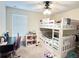 Bright bedroom features a ceiling fan, desk, and a white bunk bed with storage at 15127 Book Club Rd, Winter Garden, FL 34787