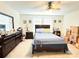 Bedroom featuring a ceiling fan, closet, bed, and a dark wood dresser at 15127 Book Club Rd, Winter Garden, FL 34787