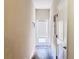 Bright hallway featuring a door with blinds and dark wood-look flooring at 15127 Book Club Rd, Winter Garden, FL 34787