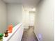 Upstairs hallway featuring neutral carpeting and white doors at 15127 Book Club Rd, Winter Garden, FL 34787