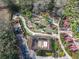 Aerial view of a community mini golf area with putting greens and landscaped features at 1520 Solana Cir, Davenport, FL 33897