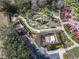 An aerial view showcases the miniature golf course, a fun amenity nestled within lush landscaping in the community center at 1520 Solana Cir, Davenport, FL 33897