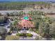 Aerial view of a community center, featuring a pool and lush landscaping for resort-style living at 1520 Solana Cir, Davenport, FL 33897