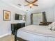 Comfortable bedroom featuring dark wood furniture and ceiling fan at 1520 Solana Cir, Davenport, FL 33897