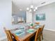 Bright dining room with an open layout, featuring a rustic wooden table and chairs at 1520 Solana Cir, Davenport, FL 33897