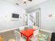 Spacious playroom featuring a colorful rug, a small table, and a television on the wall at 1520 Solana Cir, Davenport, FL 33897