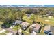 Aerial view of a neighborhood showcasing lush greenery, mature trees and well-maintained homes at 1716 Terry Ne Cir, Winter Haven, FL 33881