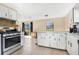 Well-lit kitchen with stainless steel appliances and a view to the backyard at 1716 Terry Ne Cir, Winter Haven, FL 33881