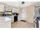 Cozy kitchen with white cabinets, tile backsplash, and modern appliances at 1716 Terry Ne Cir, Winter Haven, FL 33881