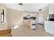 Spacious kitchen featuring white cabinets and tile flooring, ideal for Gathering gatherings at 1716 Terry Ne Cir, Winter Haven, FL 33881