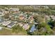 Aerial view of a residential neighborhood featuring tree-lined streets and well-kept homes at 1716 Terry Ne Cir, Winter Haven, FL 33881