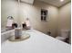 Bathroom view showcasing the modern countertop, sink, and updated fixtures with a view to the toilet at 1721 Sandalwood Sw Cir, Winter Haven, FL 33880