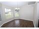 Bright dining area with tiled floors, neutral paint, white trim, and natural lighting at 1721 Sandalwood Sw Cir, Winter Haven, FL 33880