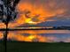 Beautiful sunset over the lake creates a stunning backdrop for this lakeside community at 18441 Mowry Ct, Orlando, FL 32827