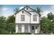 Inviting two-story farmhouse featuring a white exterior with gray trim, a welcoming front porch and lush landscaping at 1975 Iorio St, St Cloud, FL 34771