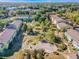 Aerial view of a well-maintained apartment complex with green spaces, trees, and convenient parking at 2019 Dixie Belle Dr # 2019W, Orlando, FL 32812