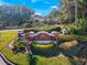 View of the community entrance sign surrounded by lush landscaping and shrubbery under a clear blue sky at 2019 Dixie Belle Dr # 2019W, Orlando, FL 32812