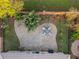 Aerial view of a landscaped backyard with a paver patio, dining area, and mature landscaping at 204 Lake Region S Blvd, Winter Haven, FL 33881