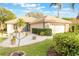 Well-maintained single-story home featuring a tile roof, blue front door, and manicured landscaping at 204 Lake Region S Blvd, Winter Haven, FL 33881