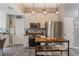 Bright kitchen with white cabinets, stainless appliances, mosaic backsplash, and wooden island cart at 204 Lake Region S Blvd, Winter Haven, FL 33881