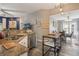 Modern kitchen open to dining area, featuring stainless steel appliances and granite countertops at 204 Lake Region S Blvd, Winter Haven, FL 33881