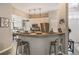 Modern kitchen with breakfast bar featuring seating and stainless steel appliances at 204 Lake Region S Blvd, Winter Haven, FL 33881