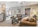 Comfortable living room featuring a large brown leather sofa and stylish area rug at 204 Lake Region S Blvd, Winter Haven, FL 33881