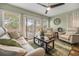 Inviting living room with neutral tones, a ceiling fan, and sliding doors to the outdoor space at 204 Lake Region S Blvd, Winter Haven, FL 33881