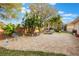 Spacious paver patio with lush landscaping, mature trees, and outdoor seating at 204 Lake Region S Blvd, Winter Haven, FL 33881