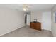 Bedroom featuring neutral walls and carpet and a wood dresser with a television on top at 2040 Touchwood Ct, Apopka, FL 32712